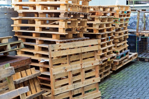 Low-emission clearance van parked outside a Willesden flat with sorted recyclable items